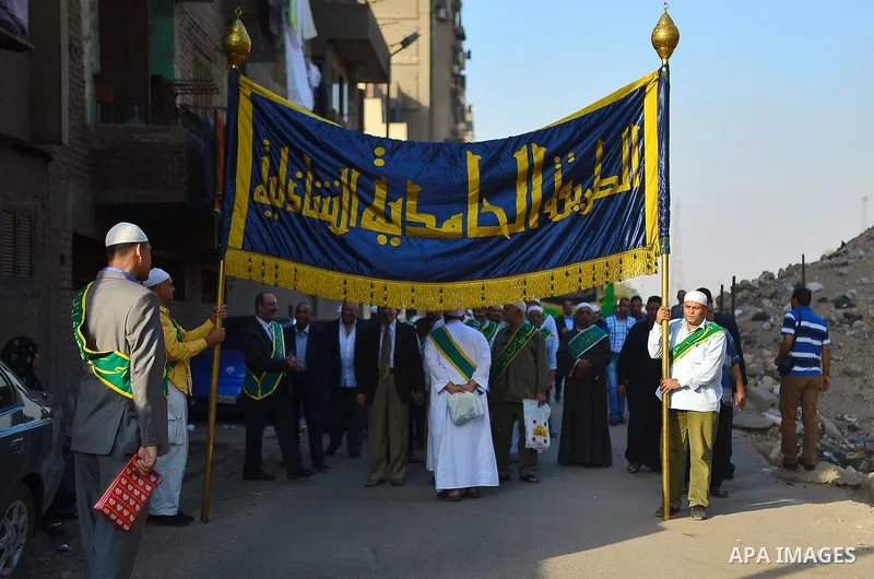 Members of Egyptian sufi muslim group parade the street during a ritual to commemorate the Hijri New Year, also known as Islamic New Year, in Cairo on October 26, 2014. The Islamic year lasts for about 354 days and consi...