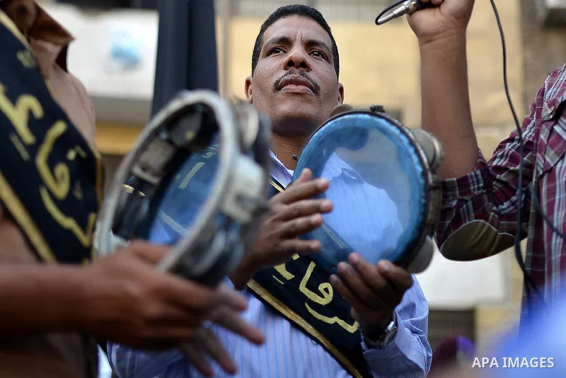 Members of Egyptian sufi muslim group play traditional instruments as they parade the street during a ritual to commemorate the Hijri New Year, also known as Islamic New Year, in Cairo on October 26, 2014. The Islamic ye...