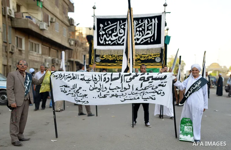 Members of Egyptian sufi muslim group parade the street during a ritual to commemorate the Hijri New Year, also known as Islamic New Year, in Cairo on October 26, 2014. The Islamic year lasts for about 354 days and consi...