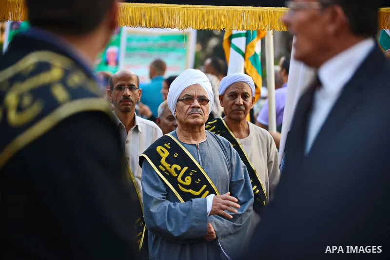Members of Egyptian sufi muslim group parade the street during a ritual to commemorate the Hijri New Year, also known as Islamic New Year, in Cairo on October 26, 2014. The Islamic year lasts for about 354 days and consi...