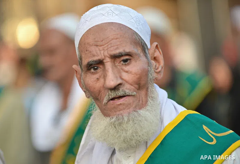 A member of Egyptian sufi muslim group performs as they parade the street during a ritual to commemorate the Hijri New Year, also known as Islamic New Year, in Cairo on October 26, 2014. The Islamic year lasts for about...