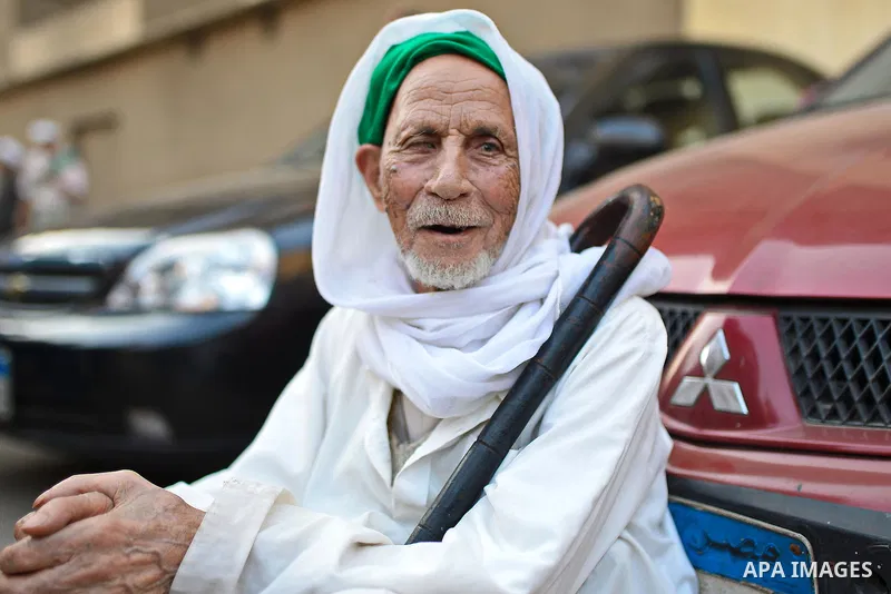 A member of Egyptian sufi muslim group performs as they parade the street during a ritual to commemorate the Hijri New Year, also known as Islamic New Year, in Cairo on October 26, 2014. The Islamic year lasts for about...