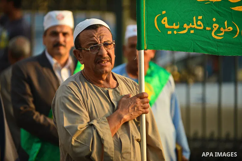 Members of Egyptian sufi muslim group parade the street during a ritual to commemorate the Hijri New Year, also known as Islamic New Year, in Cairo on October 26, 2014. The Islamic year lasts for about 354 days and consi...