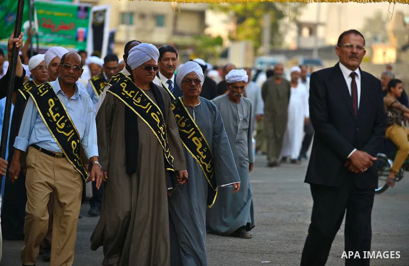 Members of Egyptian sufi muslim group parade the street during a ritual to commemorate the Hijri New Year, also known as Islamic New Year, in Cairo on October 26, 2014. The Islamic year lasts for about 354 days and consi...