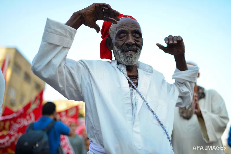 Members of Egyptian sufi muslim group perform as they parade the street during a ritual to commemorate the Hijri New Year, also known as Islamic New Year, in Cairo on October 26, 2014. The Islamic year lasts for about 35...