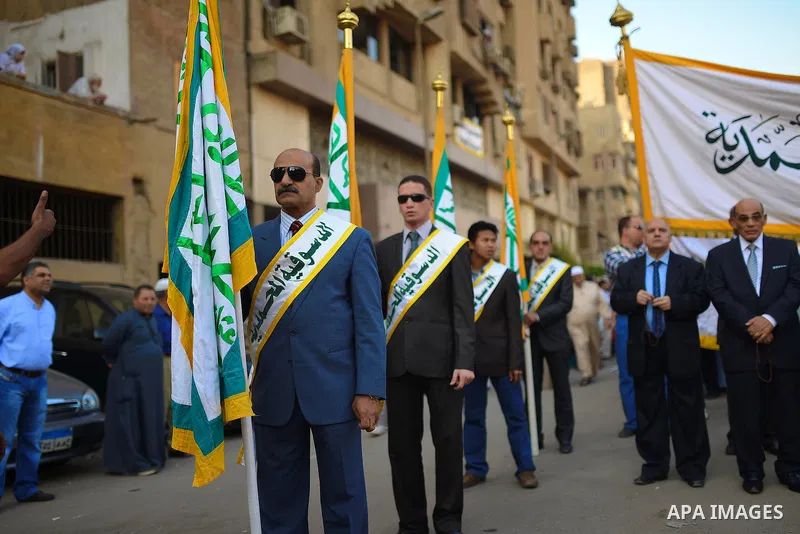 Members of Egyptian sufi muslim group parade the street during a ritual to commemorate the Hijri New Year, also known as Islamic New Year, in Cairo on October 26, 2014. The Islamic year lasts for about 354 days and consi...