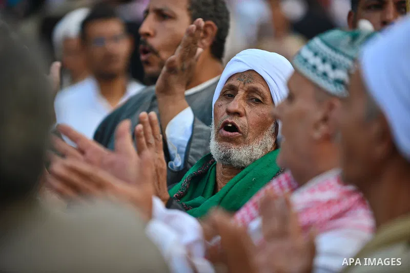 Members of Egyptian sufi muslim group perform as they parade the street during a ritual to commemorate the Hijri New Year, also known as Islamic New Year, in Cairo on October 26, 2014. The Islamic year lasts for about 35...