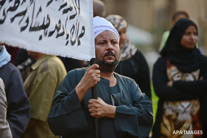 Members of Egyptian sufi muslim group parade the street during a ritual to commemorate the Hijri New Year, also known as Islamic New Year, in Cairo on October 26, 2014. The Islamic year lasts for about 354 days and consi...