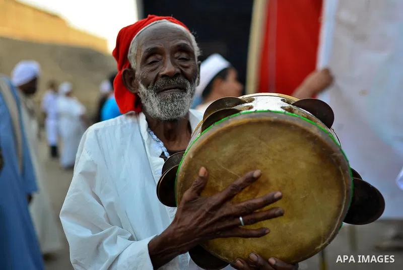 Members of Egyptian sufi muslim group play traditional instruments as they parade the street during a ritual to commemorate the Hijri New Year, also known as Islamic New Year, in Cairo on October 26, 2014. The Islamic ye...