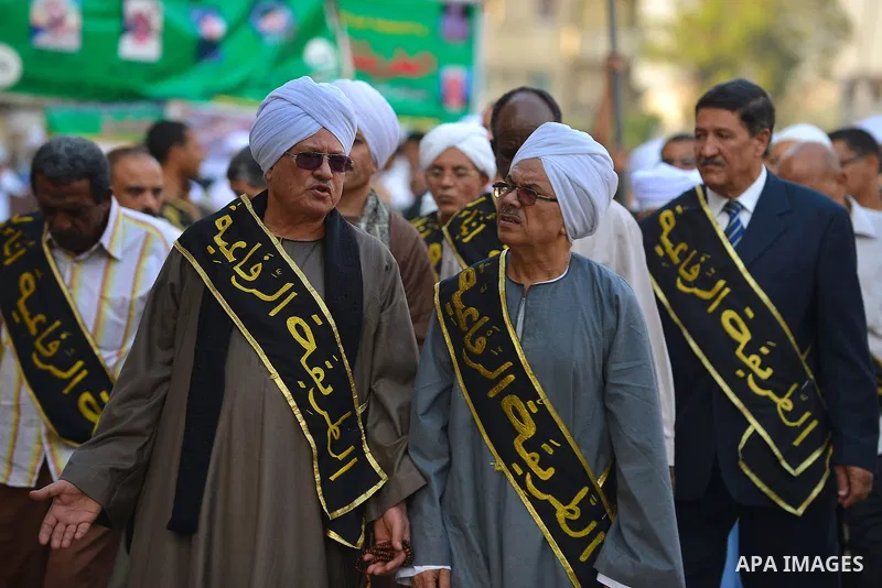 Members of Egyptian sufi muslim group parade the street during a ritual to commemorate the Hijri New Year, also known as Islamic New Year, in Cairo on October 26, 2014. The Islamic year lasts for about 354 days and consi...