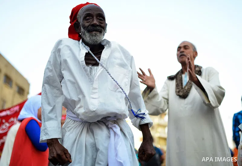 Members of Egyptian sufi muslim group perform as they parade the street during a ritual to commemorate the Hijri New Year, also known as Islamic New Year, in Cairo on October 26, 2014. The Islamic year lasts for about 35...