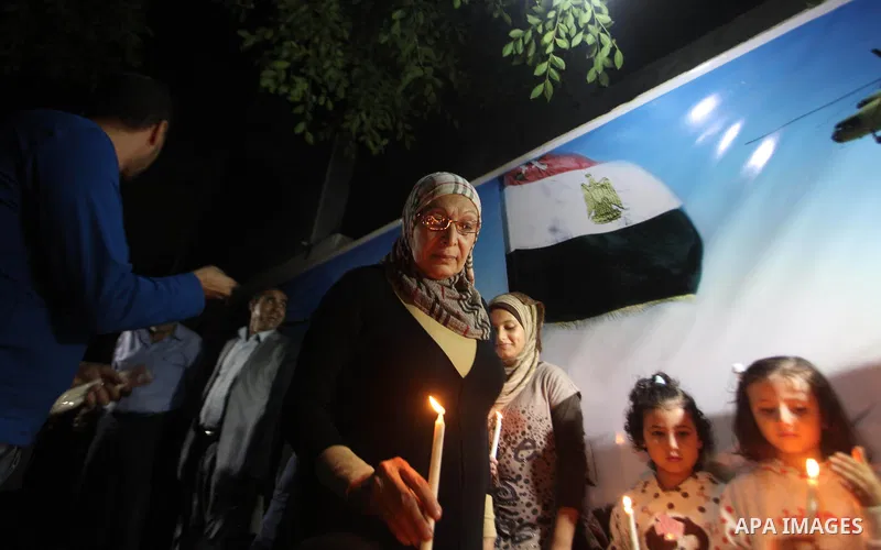 Palestinians light candles to mourn victims of the Egyptian soldiers killed in a suicide attack in Sinai on Friday, at the Egyptian community headquarter in Gaza city October 28, 2014. Cairo shut the vital crossing follo...