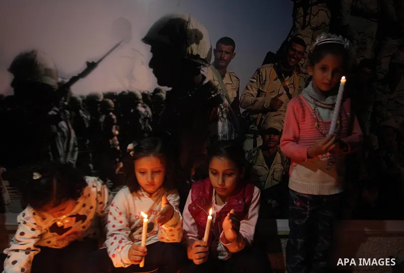 Palestinians light candles to mourn victims of the Egyptian soldiers killed in a suicide attack in Sinai on Friday, at the Egyptian community headquarter in Gaza city October 28, 2014. Cairo shut the vital crossing follo...