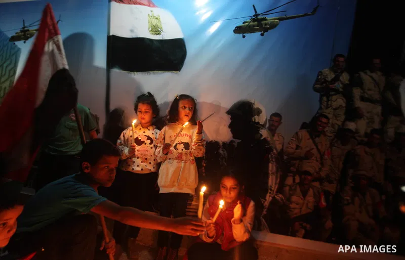 Palestinians light candles to mourn victims of the Egyptian soldiers killed in a suicide attack in Sinai on Friday, at the Egyptian community headquarter in Gaza city October 28, 2014. Cairo shut the vital crossing follo...