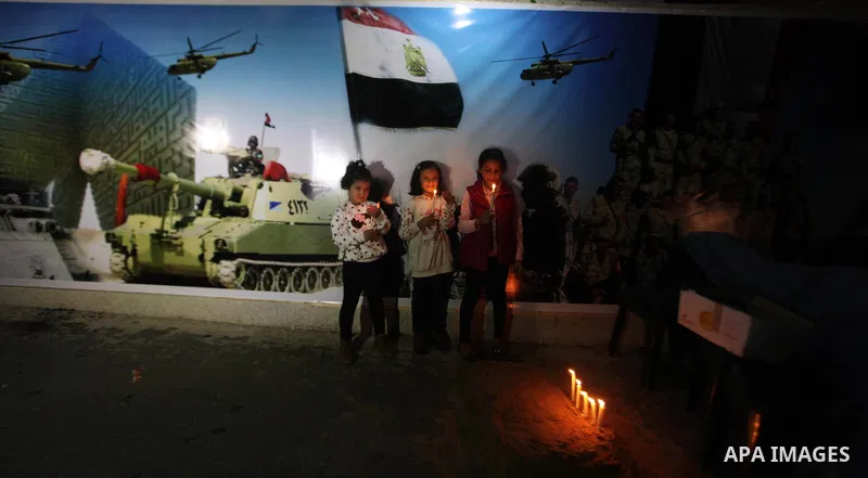Palestinians light candles to mourn victims of the Egyptian soldiers killed in a suicide attack in Sinai on Friday, at the Egyptian community headquarter in Gaza city October 28, 2014. Cairo shut the vital crossing follo...