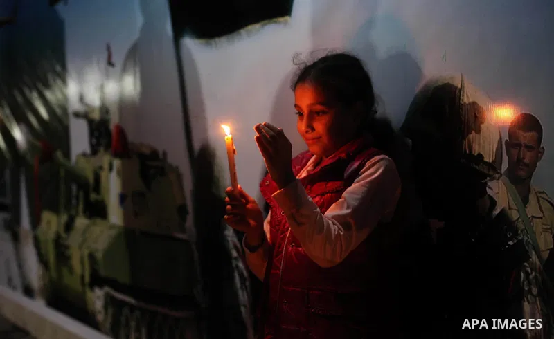 Palestinians light candles to mourn victims of the Egyptian soldiers killed in a suicide attack in Sinai on Friday, at the Egyptian community headquarter in Gaza city October 28, 2014. Cairo shut the vital crossing follo...