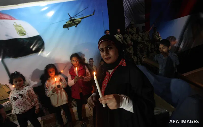 Palestinians light candles to mourn victims of the Egyptian soldiers killed in a suicide attack in Sinai on Friday, at the Egyptian community headquarter in Gaza city October 28, 2014. Cairo shut the vital crossing follo...