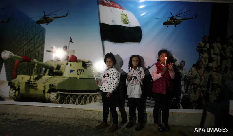 Palestinians light candles to mourn victims of the Egyptian soldiers killed in a suicide attack in Sinai on Friday, at the Egyptian community headquarter in Gaza city October 28, 2014. Cairo shut the vital crossing follo...