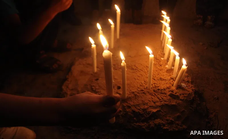 Palestinians light candles to mourn victims of the Egyptian soldiers killed in a suicide attack in Sinai on Friday, at the Egyptian community headquarter in Gaza city October 28, 2014. Cairo shut the vital crossing follo...