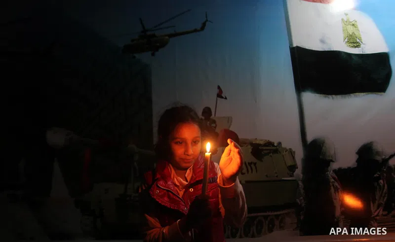 Palestinians light candles to mourn victims of the Egyptian soldiers killed in a suicide attack in Sinai on Friday, at the Egyptian community headquarter in Gaza city October 28, 2014. Cairo shut the vital crossing follo...