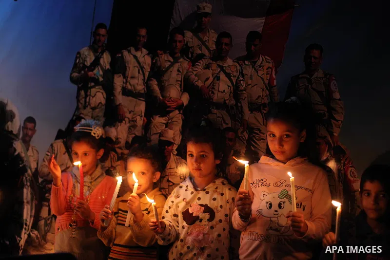 Palestinians light candles to mourn victims of the Egyptian soldiers killed in a suicide attack in Sinai on Friday, at the Egyptian community headquarter in Gaza city October 28, 2014. Cairo shut the vital crossing follo...
