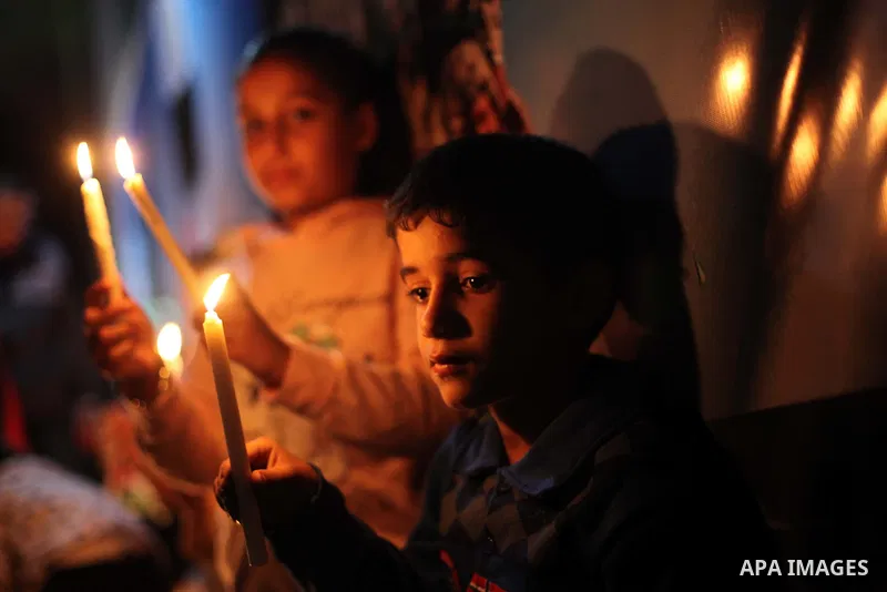 Palestinians light candles to mourn victims of the Egyptian soldiers killed in a suicide attack in Sinai on Friday, at the Egyptian community headquarter in Gaza city October 28, 2014. Cairo shut the vital crossing follo...