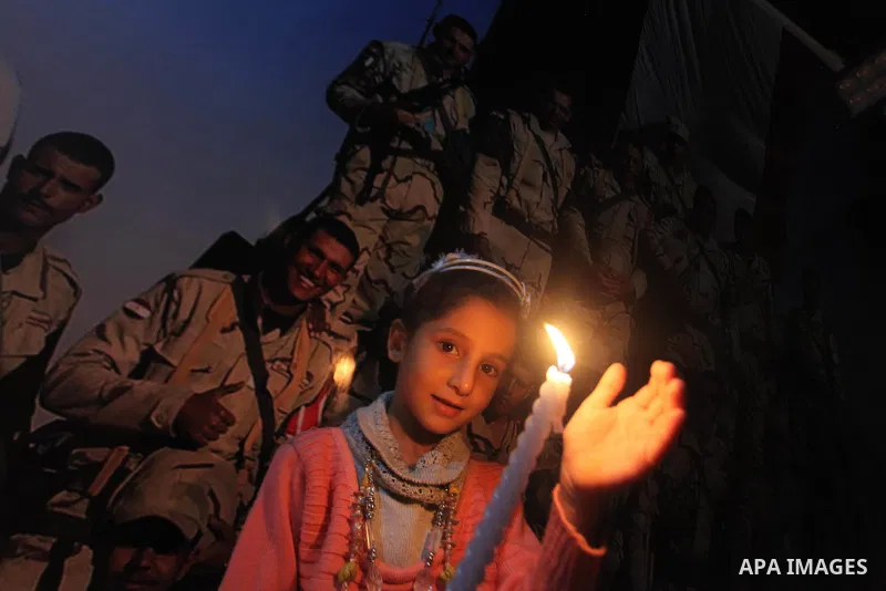 Palestinians light candles to mourn victims of the Egyptian soldiers killed in a suicide attack in Sinai on Friday, at the Egyptian community headquarter in Gaza city October 28, 2014. Cairo shut the vital crossing follo...