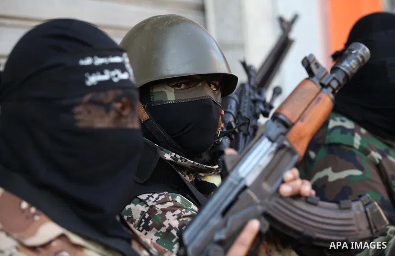 Palestinian militants from the al-Nasser Brigades, an armed wing of the Popular Resistance Committees (PRC), attend a press conference in solidarity with the victims of the Egyptian soldiers who were killed in a suicide...