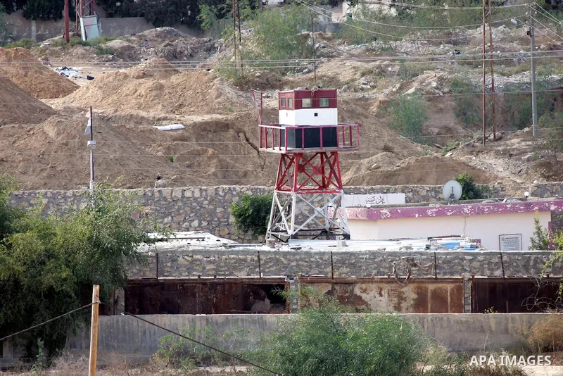 Egyptian soldiers stand guard on a tower during a military operation to demolish some buildings in the Egyptian city of Rafah near the border with southern Gaza Strip October 29, 2014, as Egypt began setting up a buffer...