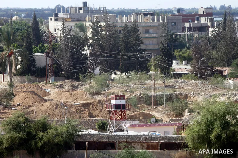 Egyptian soldiers stand guard on a tower during a military operation to demolish some buildings in the Egyptian city of Rafah near the border with southern Gaza Strip October 29, 2014, as Egypt began setting up a buffer...