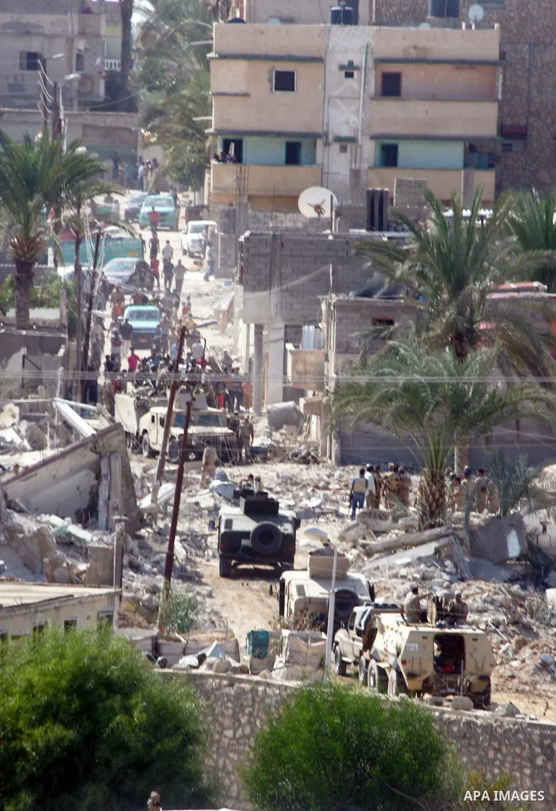 Egyptian security forces take part in a military operation to demolish some buildings in the Egyptian city of Rafah near the border with southern Gaza Strip October 29, 2014, as Egypt began setting up a buffer zone along...