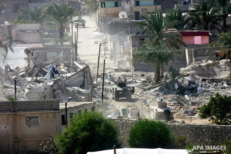 Egyptian security forces take part in a military operation to demolish some buildings in the Egyptian city of Rafah near the border with southern Gaza Strip October 29, 2014, as Egypt began setting up a buffer zone along...