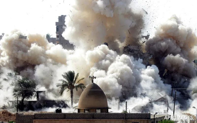 Smoke rises after a house was blown up during a military operation by Egyptian security forces in the Egyptian city of Rafah near the border with southern Gaza Strip October 29, 2014, as Egypt began setting up a buffer z...