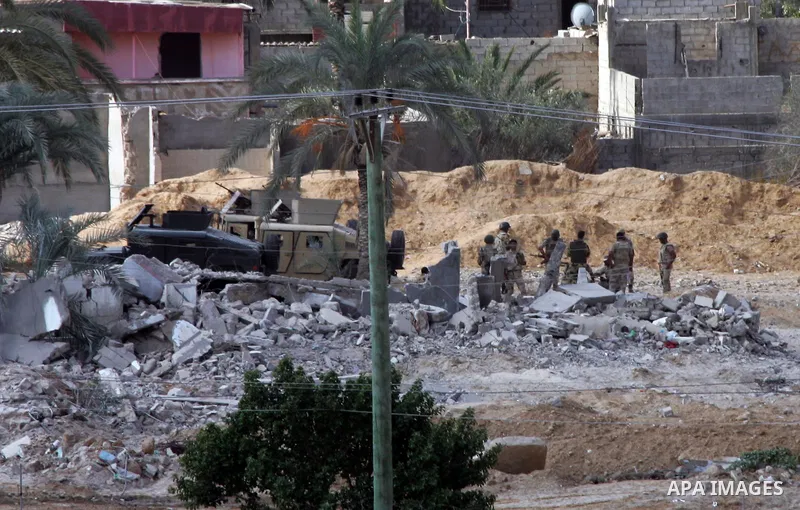 Egyptian security forces take part in a military operation to demolish some buildings in the Egyptian city of Rafah near the border with southern Gaza Strip October 29, 2014, as Egypt began setting up a buffer zone along...