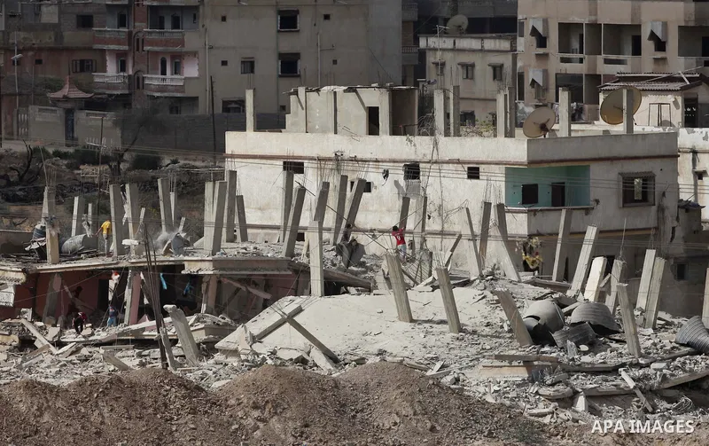 Egyptians inspect a house after it was demolished by Egyptian security forces during a military operation in the Egyptian city of Rafah near the border with southern Gaza Strip October 30, 2014, as Egypt began setting up...