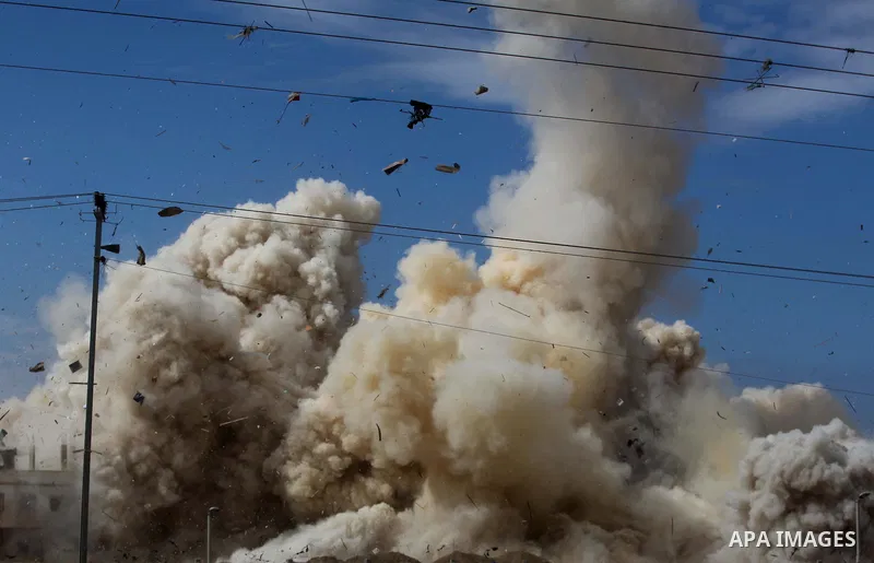 Smoke rises after a house was blown up during a military operation by Egyptian security forces in the Egyptian city of Rafah near the border with southern Gaza Strip October 30, 2014, as Egypt began setting up a buffer z...