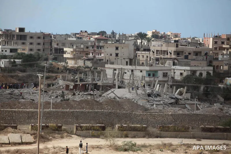 Egyptians inspect a house after it was demolished by Egyptian security forces during a military operation in the Egyptian city of Rafah near the border with southern Gaza Strip October 30, 2014, as Egypt began setting up...