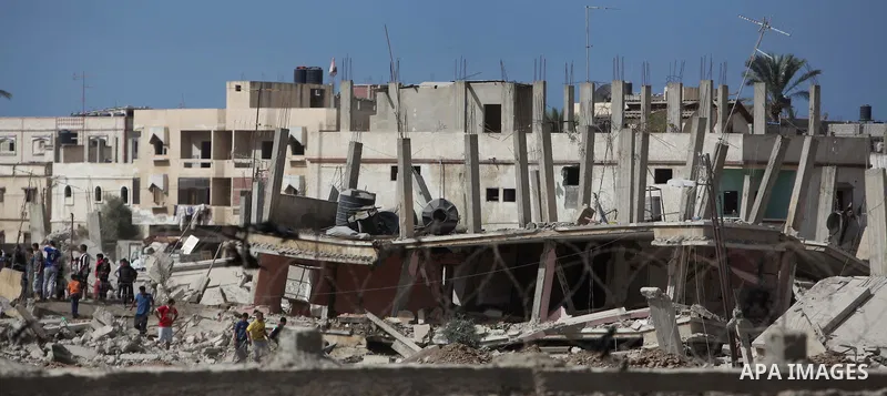 Egyptians inspect a house after it was demolished by Egyptian security forces during a military operation in the Egyptian city of Rafah near the border with southern Gaza Strip October 30, 2014, as Egypt began setting up...
