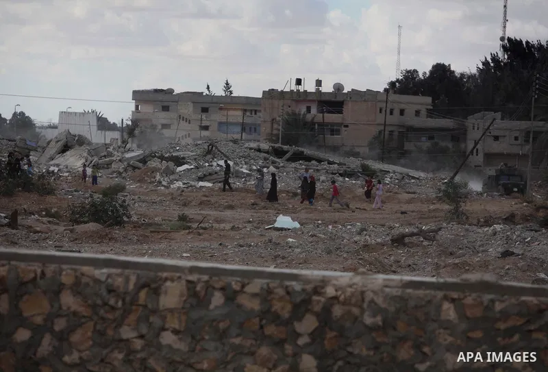 Egyptians inspect a house after it was demolished by Egyptian security forces during a military operation in the Egyptian city of Rafah near the border with southern Gaza Strip October 30, 2014, as Egypt began setting up...