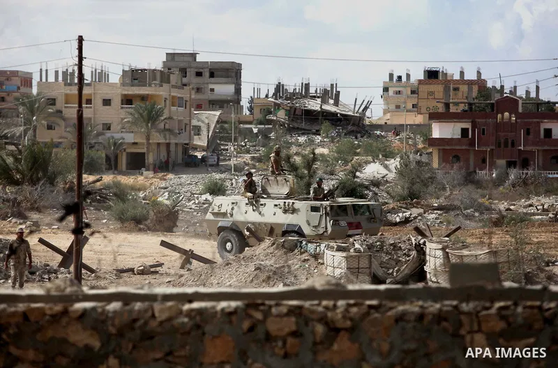 Egyptian soldiers take part in a military operation in the Egyptian city of Rafah, near the border with the southern Gaza Strip on October 30, 2014, as Egypt began setting up a buffer zone along the border with the Hamas...