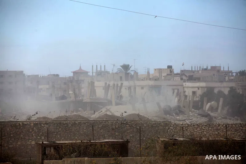 Smoke rises after a house was blown up during a military operation by Egyptian security forces in the Egyptian city of Rafah near the border with southern Gaza Strip October 30, 2014, as Egypt began setting up a buffer z...