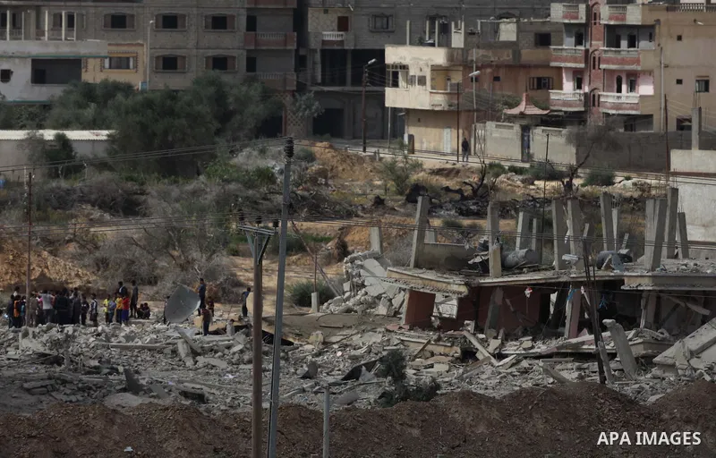 Egyptians inspect a house after it was demolished by Egyptian security forces during a military operation in the Egyptian city of Rafah near the border with southern Gaza Strip October 30, 2014, as Egypt began setting up...