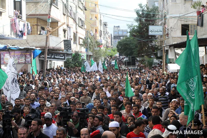 Palestinian Hamas supporters take part in a demonstration against Israeli restrictions at the Al-Aqsa Mosque compound, and in solidarity with the people in Jerusalem, in Jabalia in the northern Gaza Strip, October 31, 20...