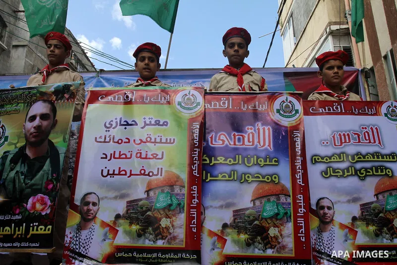 Palestinian Hamas supporters take part in a demonstration against Israeli restrictions at the Al-Aqsa Mosque compound, and in solidarity with the people in Jerusalem, in Jabalia in the northern Gaza Strip, October 31, 20...