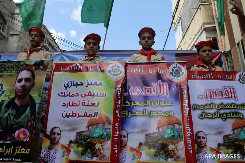 Palestinian Hamas supporters take part in a demonstration against Israeli restrictions at the Al-Aqsa Mosque compound, and in solidarity with the people in Jerusalem, in Jabalia in the northern Gaza Strip, October 31, 20...