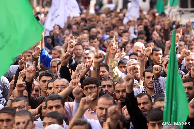 Palestinian Hamas supporters take part in a demonstration against Israeli restrictions at the Al-Aqsa Mosque compound, and in solidarity with the people in Jerusalem, in Jabalia in the northern Gaza Strip, October 31, 20...