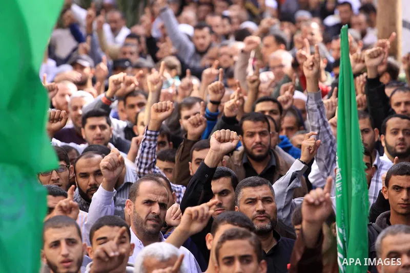 Palestinian Hamas supporters take part in a demonstration against Israeli restrictions at the Al-Aqsa Mosque compound, and in solidarity with the people in Jerusalem, in Jabalia in the northern Gaza Strip, October 31, 20...
