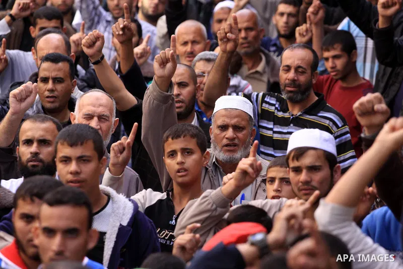 Palestinian Hamas supporters take part in a demonstration against Israeli restrictions at the Al-Aqsa Mosque compound, and in solidarity with the people in Jerusalem, in Jabalia in the northern Gaza Strip, October 31, 20...