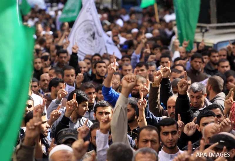 Palestinian Hamas supporters take part in a demonstration against Israeli restrictions at the Al-Aqsa Mosque compound, and in solidarity with the people in Jerusalem, in Jabalia in the northern Gaza Strip, October 31, 20...