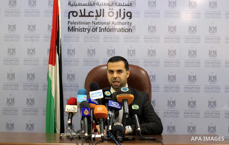 Eyad al-Bozm, the spokesman of the Palestinian Ministry of the Interior, speak during a press conference, in Gaza city November 7, 2014. At least 10 explosions hit houses and cars belonging to members of President Mahmou...